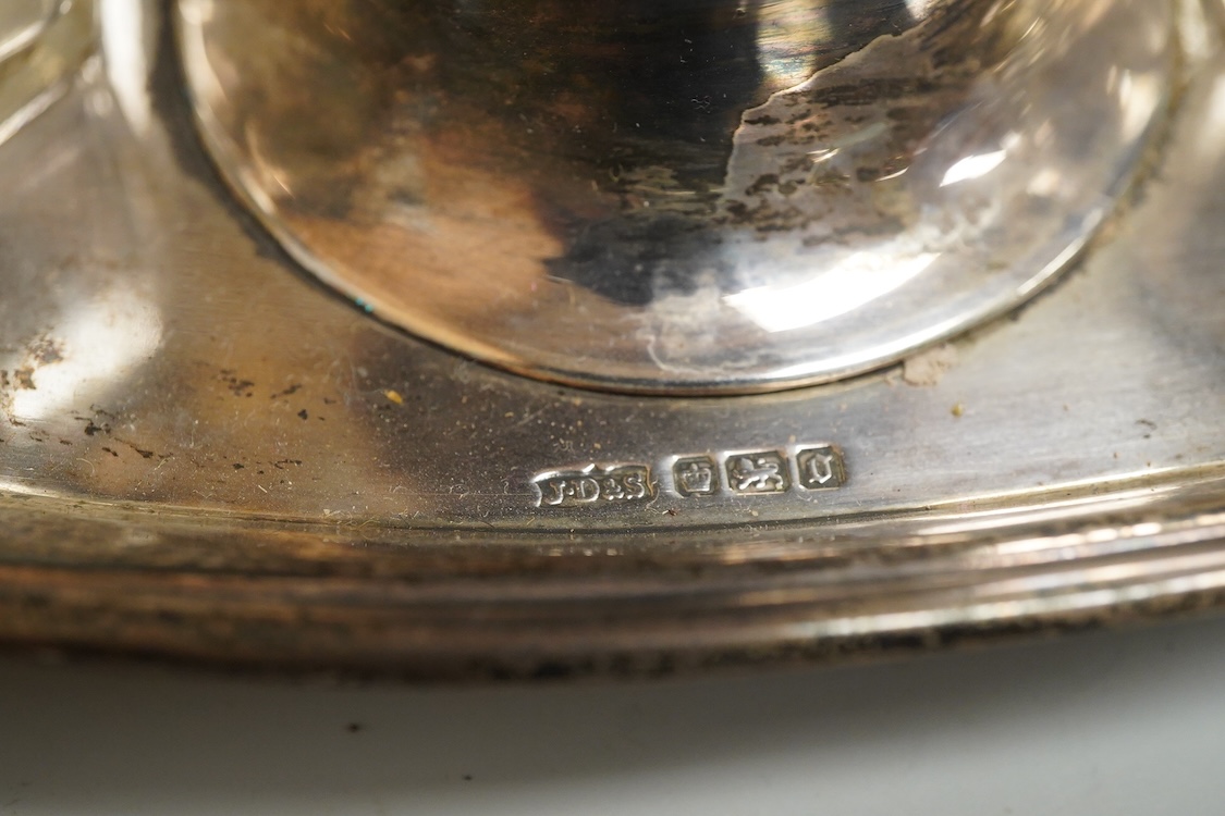 An Edwardian silver elliptical shaped inkstand, with two mounted glass wells and central pen wipe, James Dixon & Sons, Sheffield, 1906, together with ten Danish sterling and polychrome enamel spoons(a.f) and a cased set